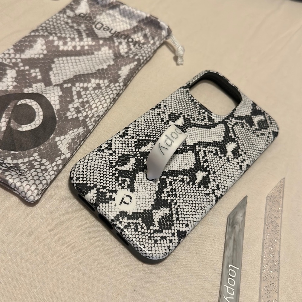 iPhone 13 Pro Max loopy case. No damage. Comes w/ dust bag and two extra loops.